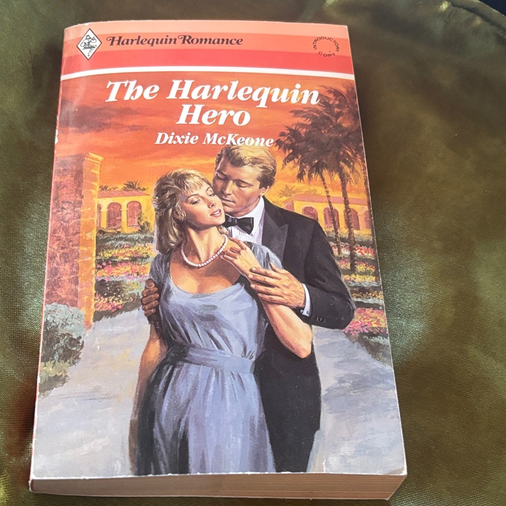 The Harlequin Hero by Dixie McKeone - Orange and Blue Cover